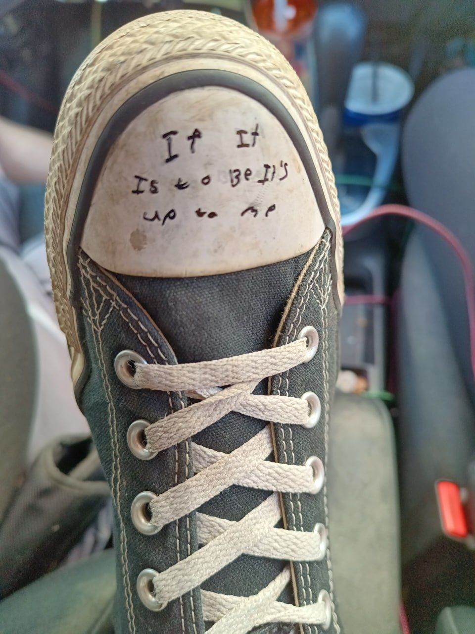 Motto written on Converse